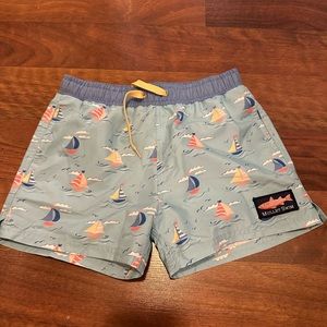 New without tag/bag. Boys shrimp and grits swim trunks size large (7/8)